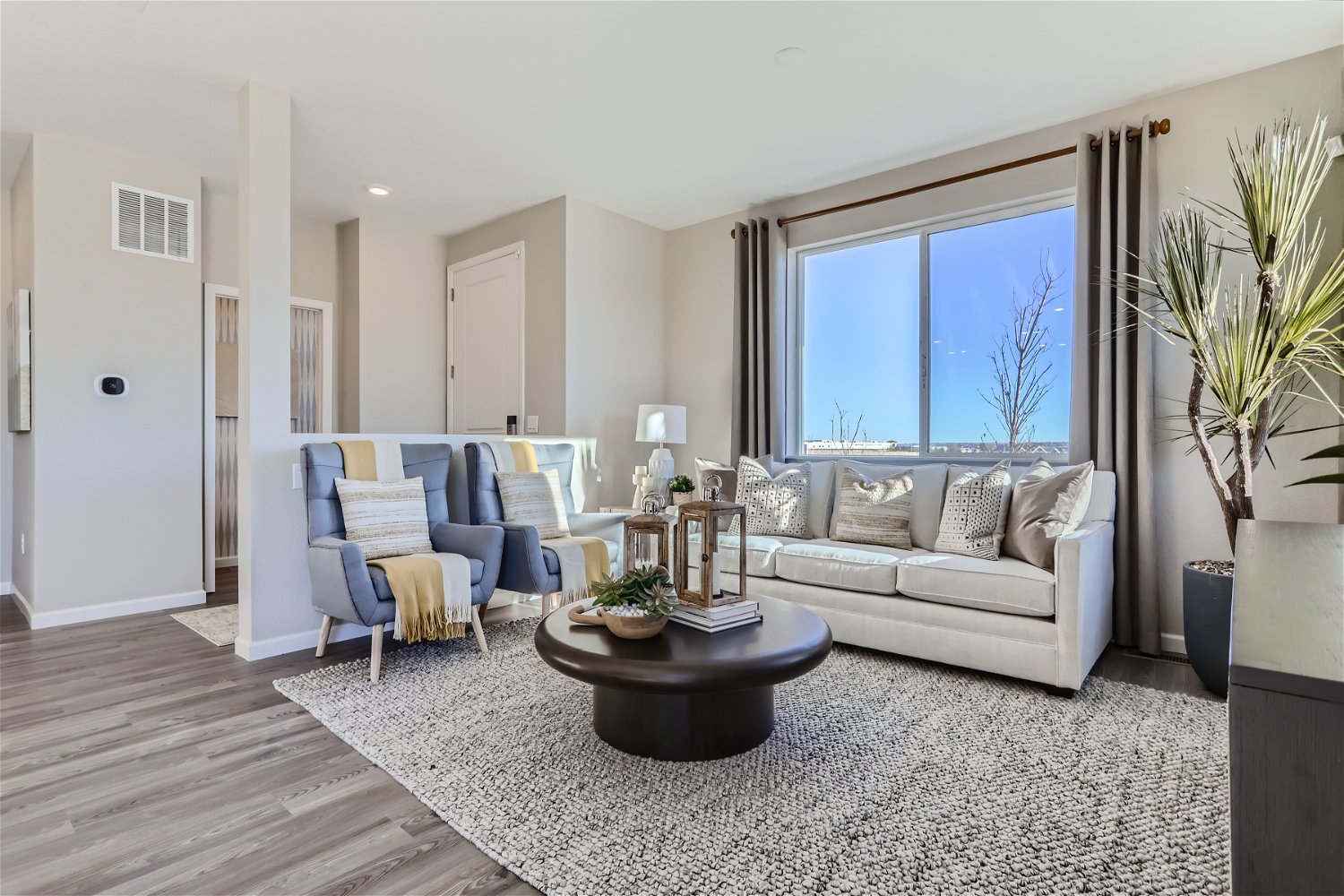 A living room with a large window.