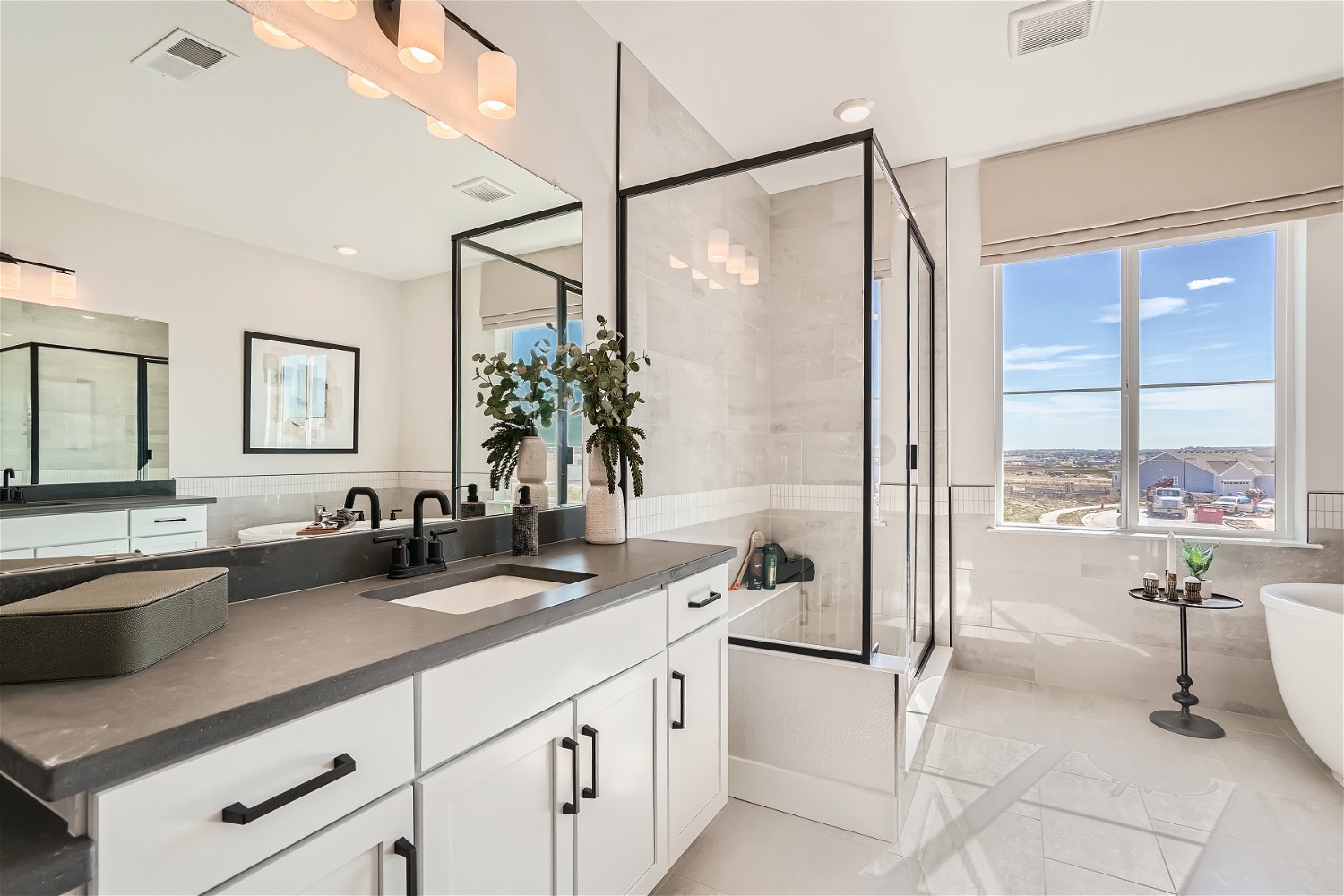 A kitchen with a large glass shower.