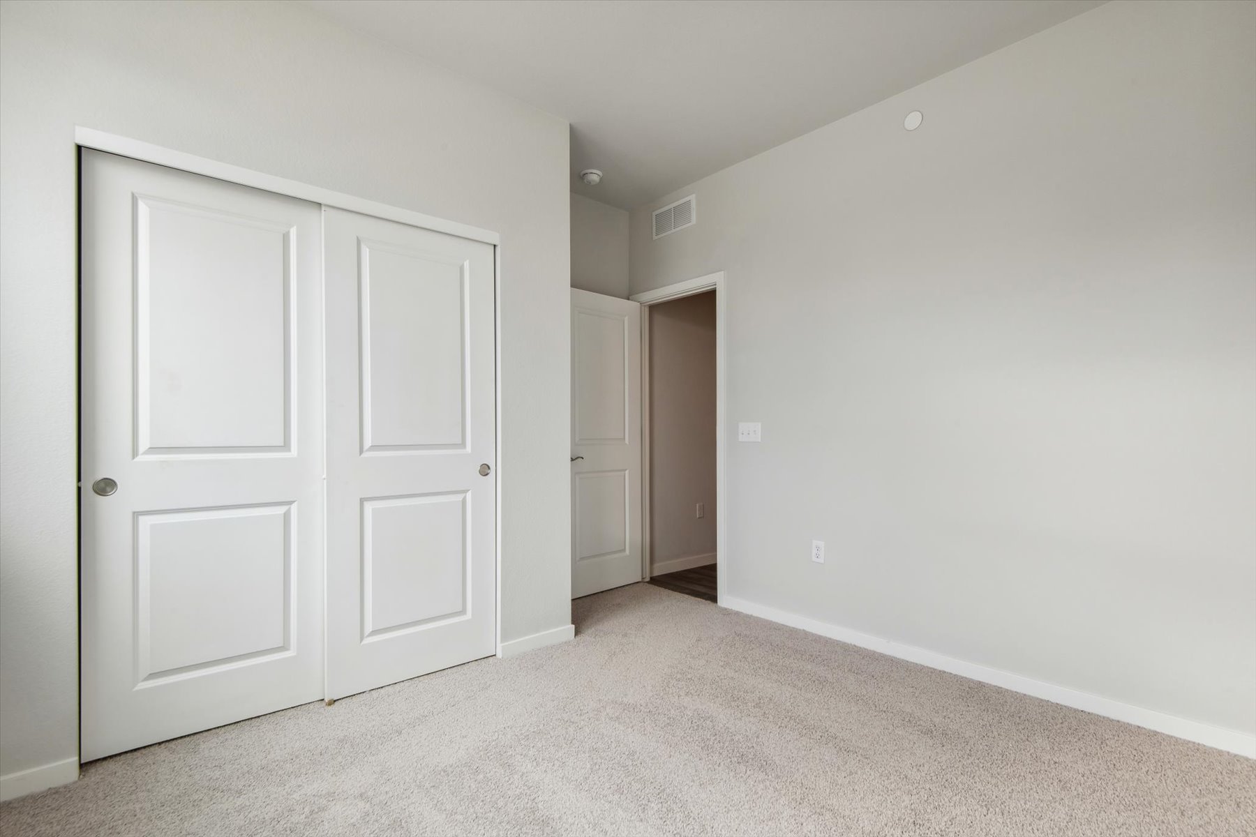 A room with white doors.