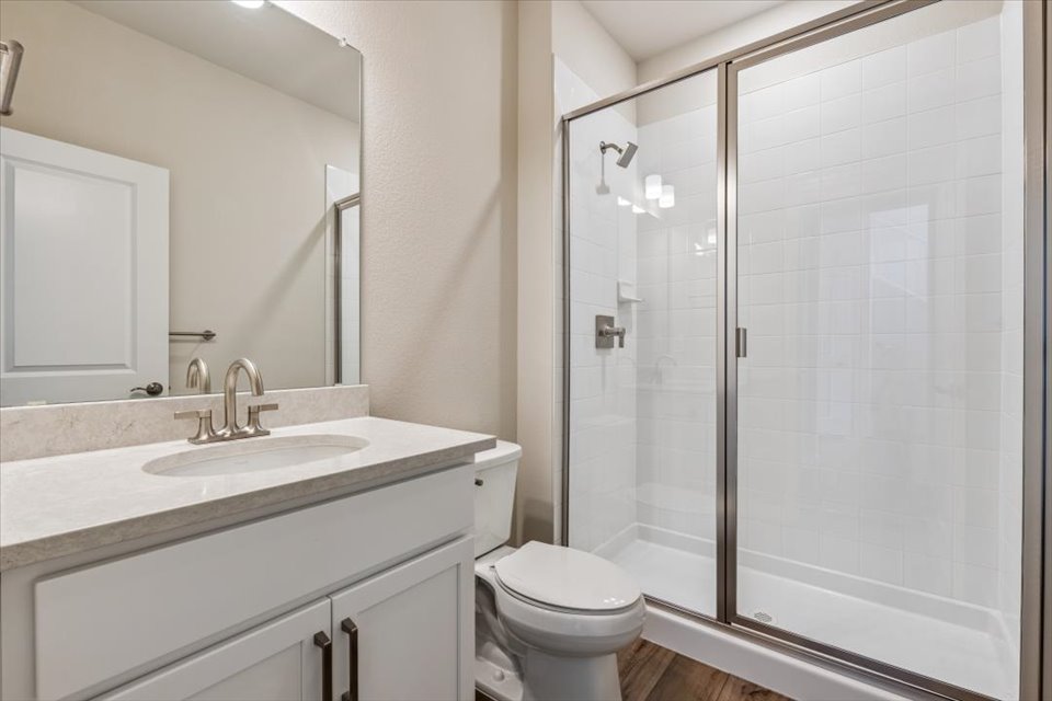 A bathroom with a glass shower.