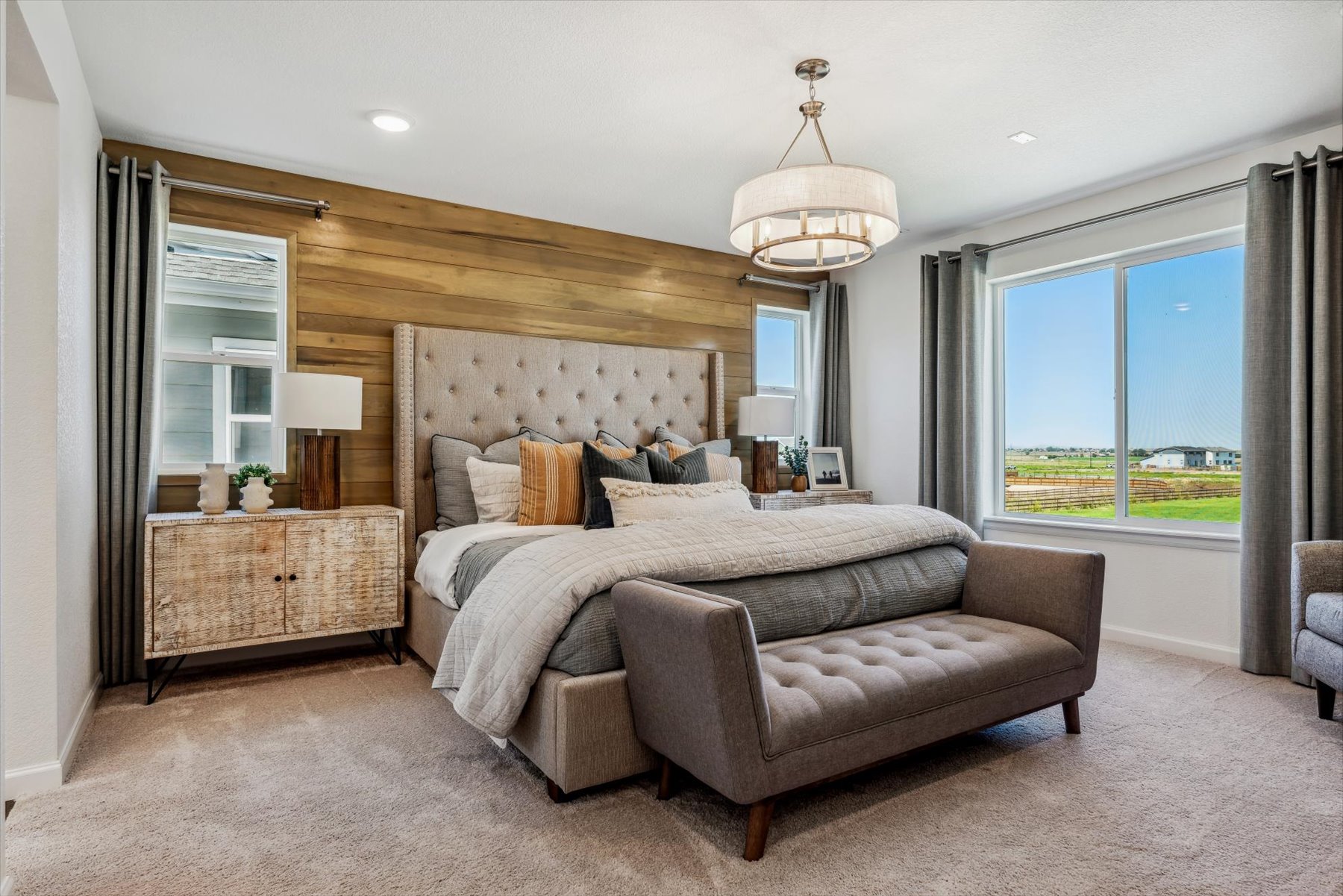 A bedroom with a bed and a couch.