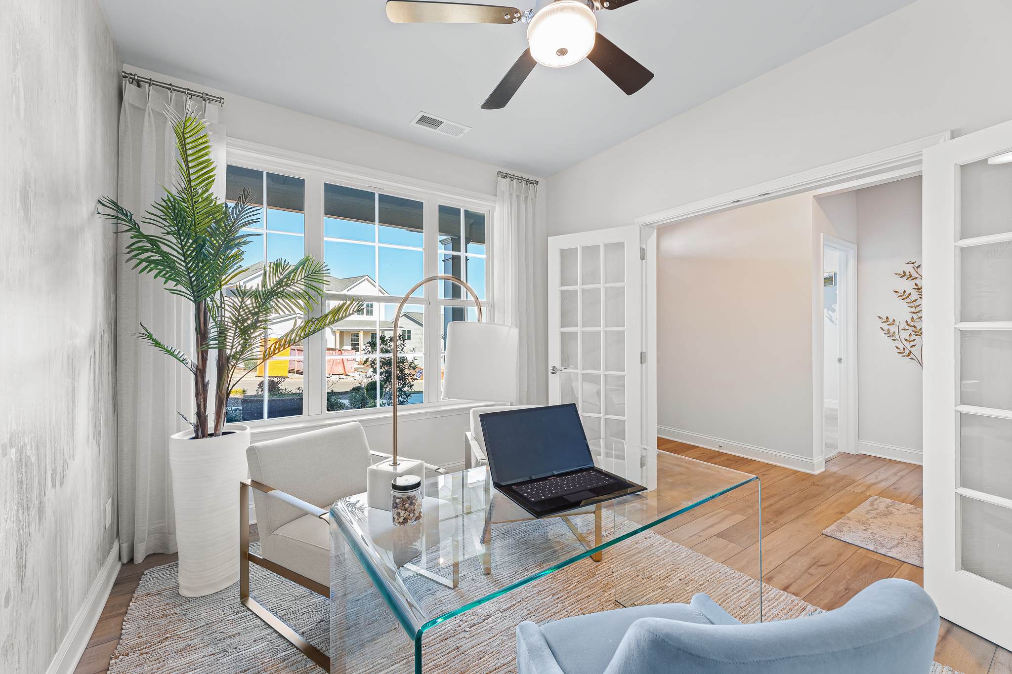 A room with a table and chairs.