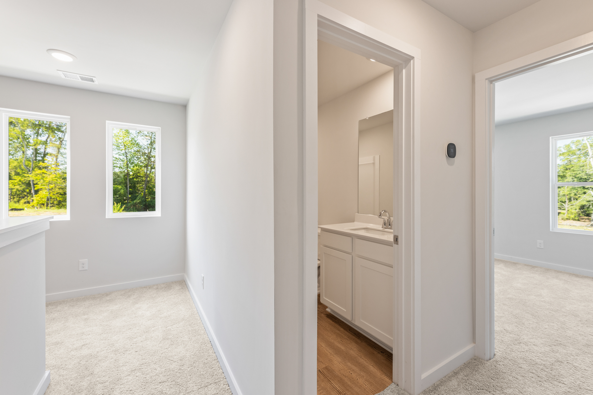 A bathroom with white walls.