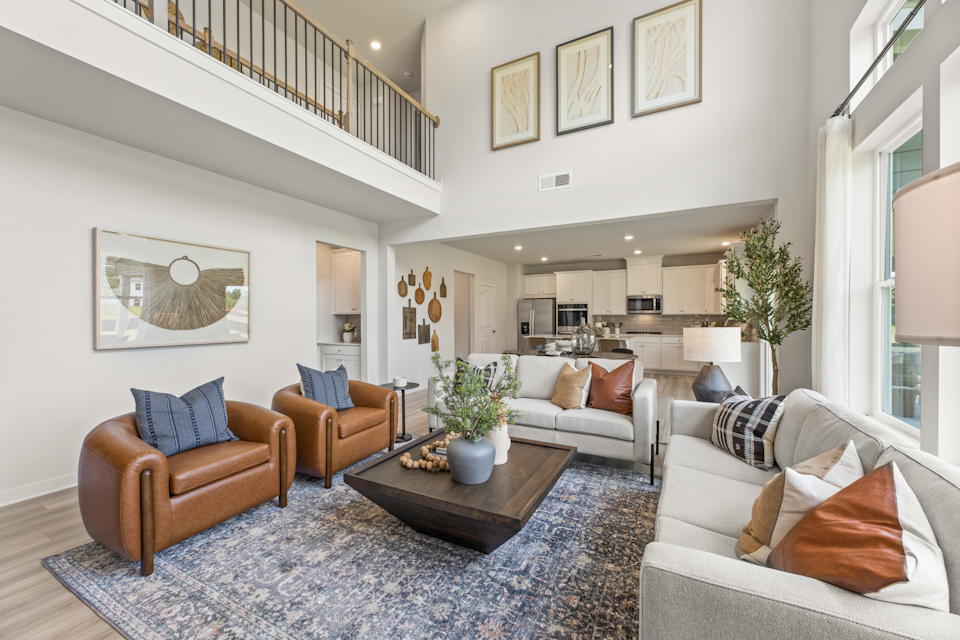 A living room with a couch and chairs.