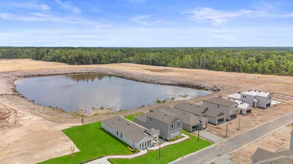 A group of buildings next to a body of water.