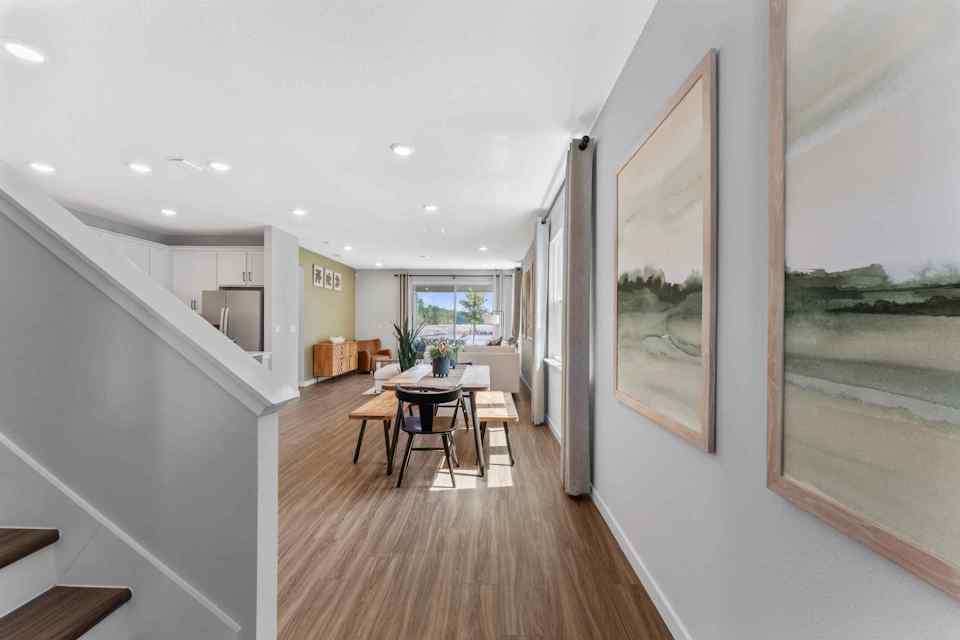 A room with a table and chairs.