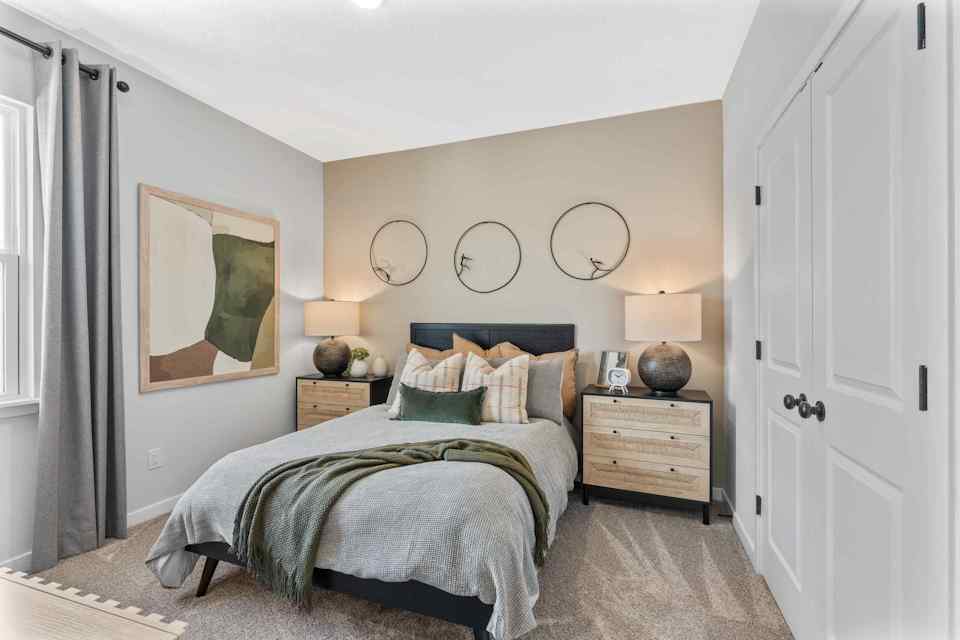 Silverbell II Model Home Guest Room with Bed and Nighstands at Camden Woods in Kingsland, GA