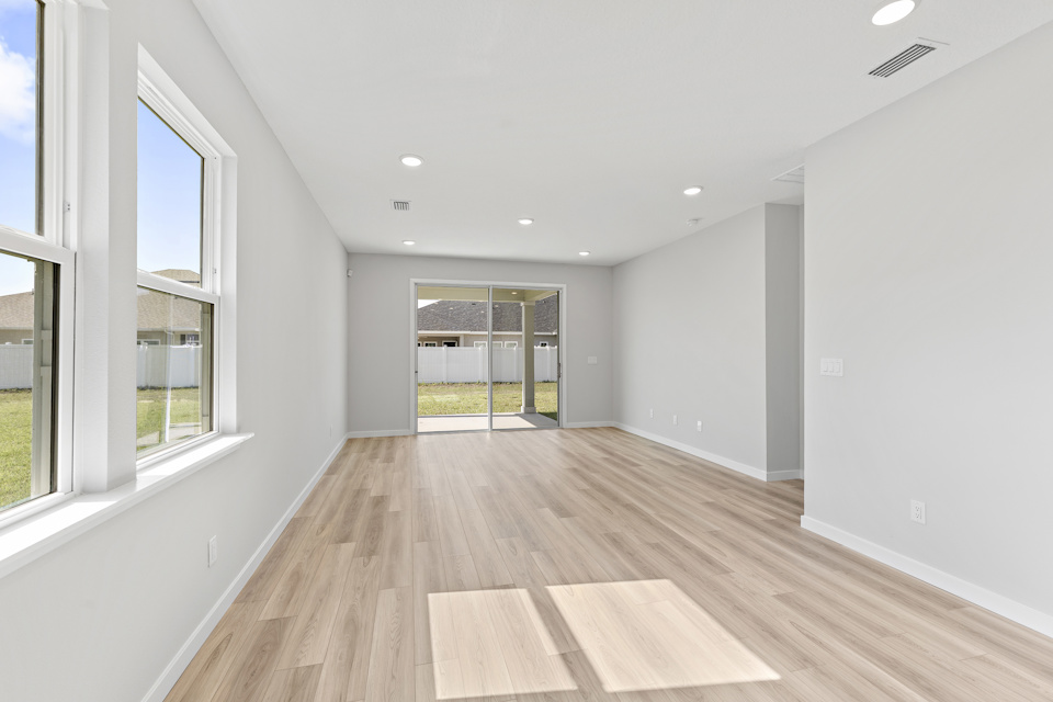 Open Dining Area with Light LVP Flooring in Lot 19 Cedar II at Camden Woods in Kingsland, GA
