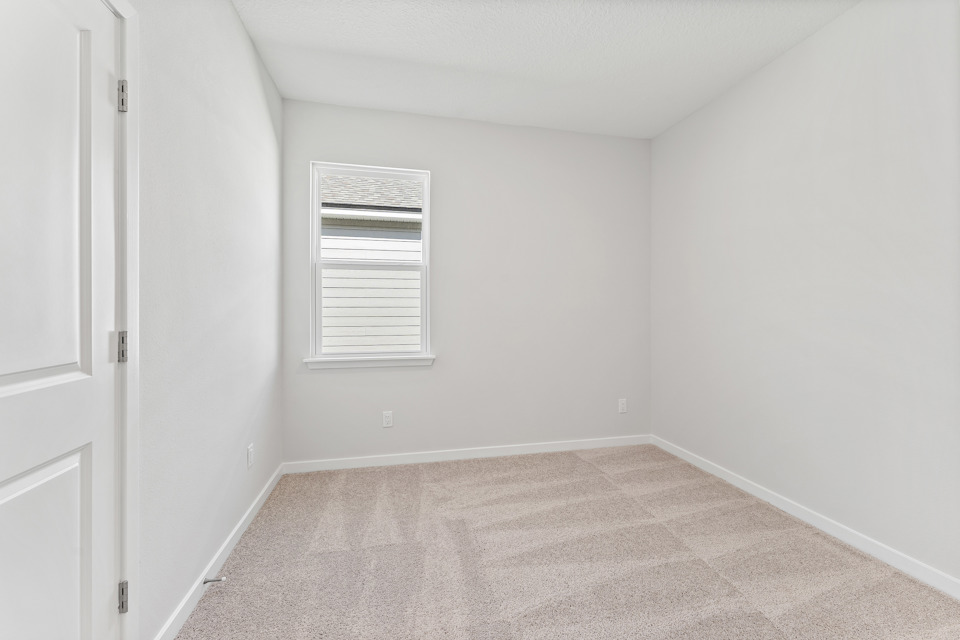 Lot 19 Cedar II Guest Room with Window and Closet at Camden Woods in Kingsland, GA