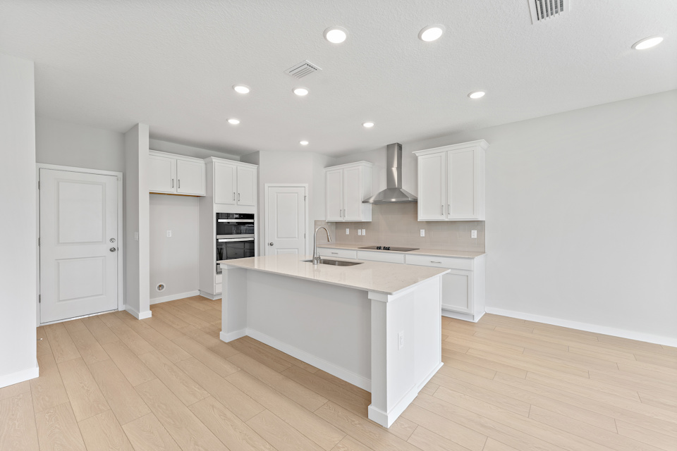 Lot 20 Ponderosa II Chef's Kitchen with Corner Pantry and Island at Camden Woods in Kingsland, GA