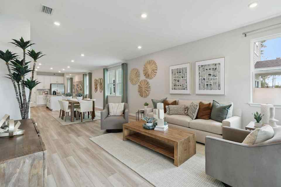 A large living room with a wood floor and a wood floor.