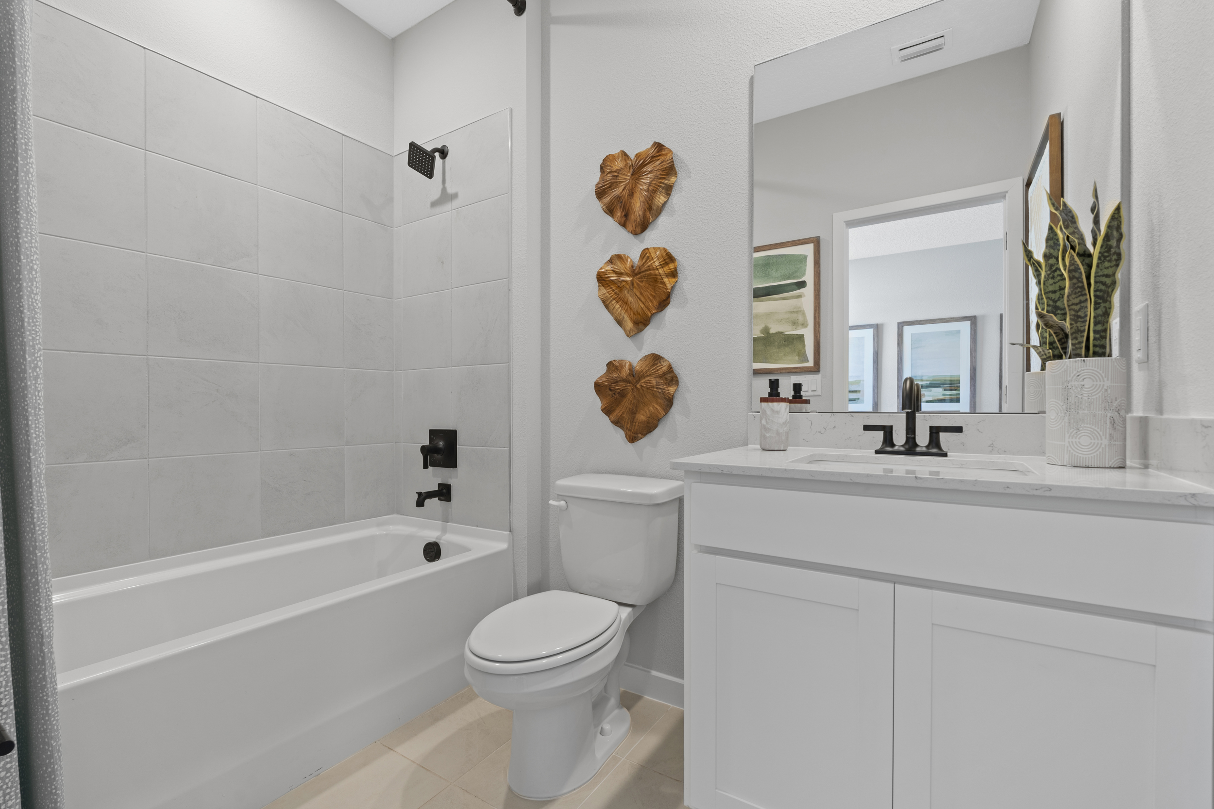 Kenai Model Home Guest Bath with Tub and Shower at Reserve East in Flagler Beach