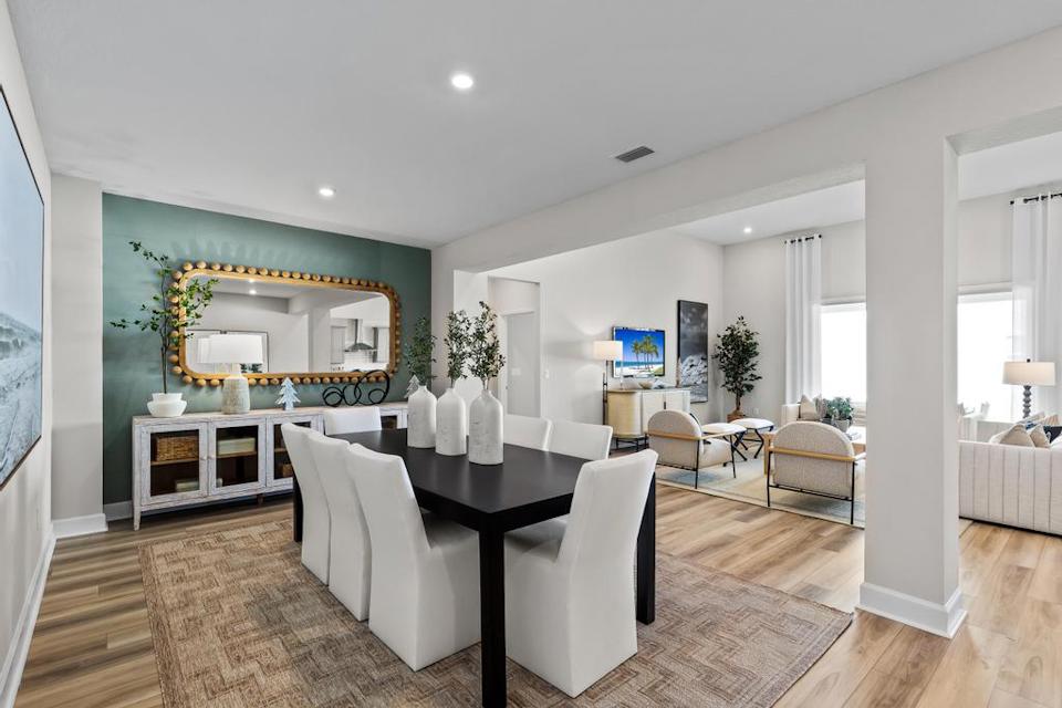 A large living room with a large mirror.