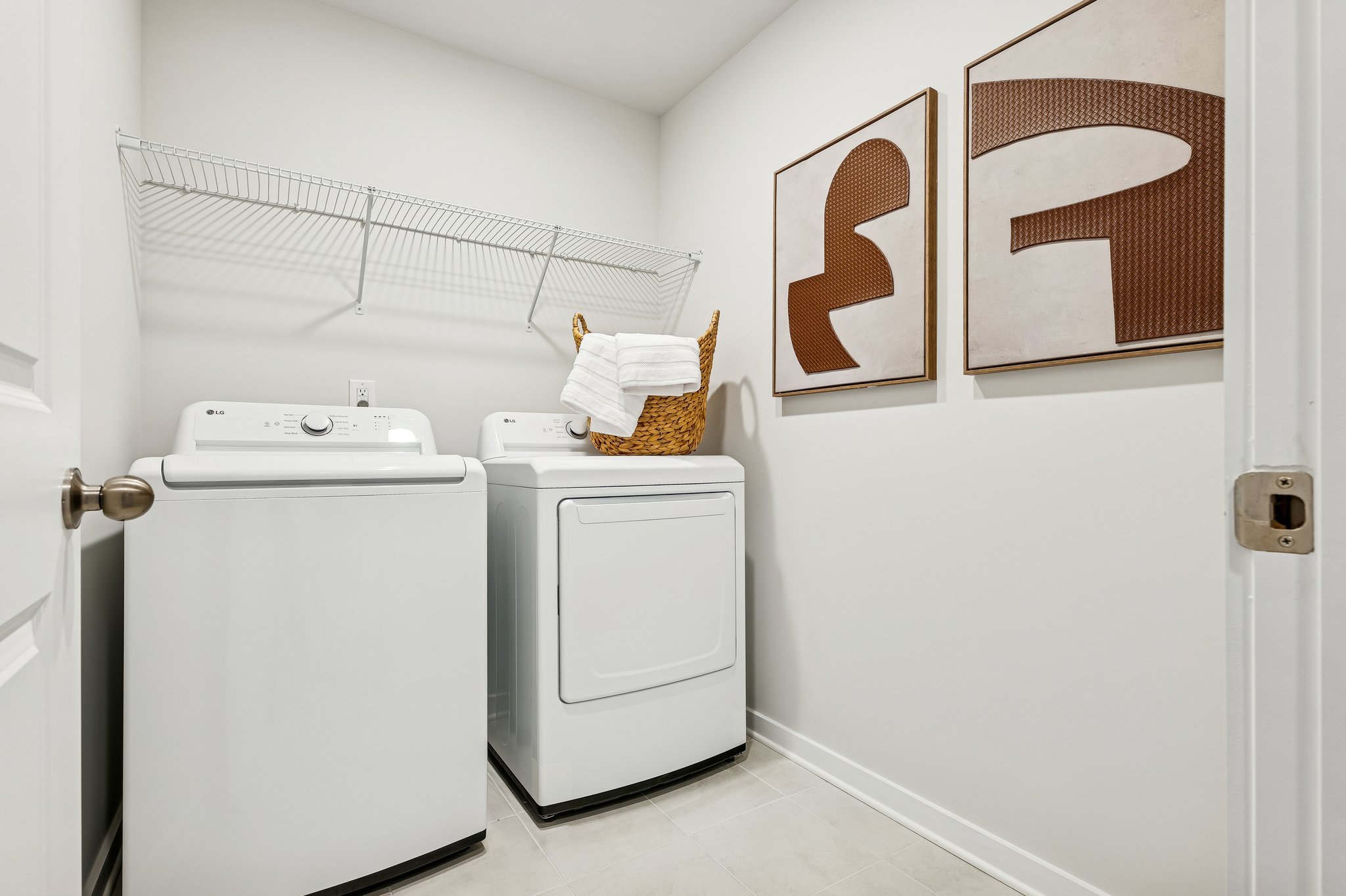 A laundry room with a washer and dryer.