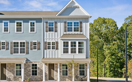 A large building with trees in front of it.