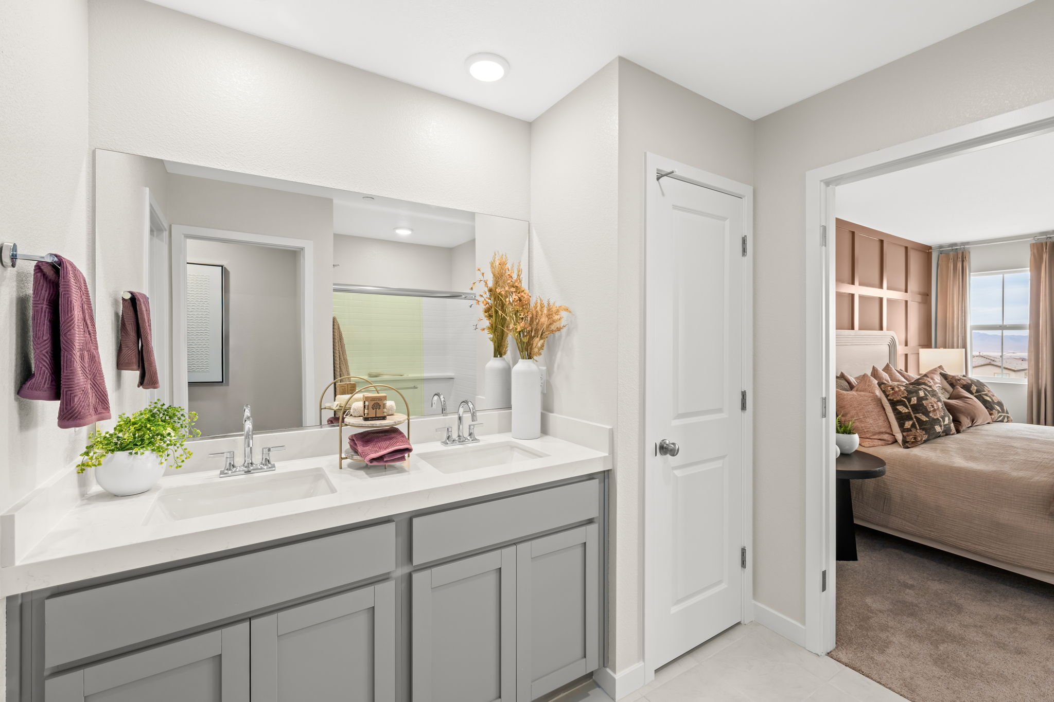 A bathroom with a large mirror.