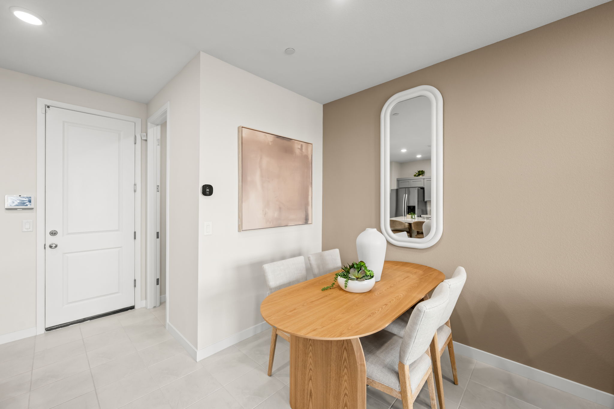 A room with a table and chairs.