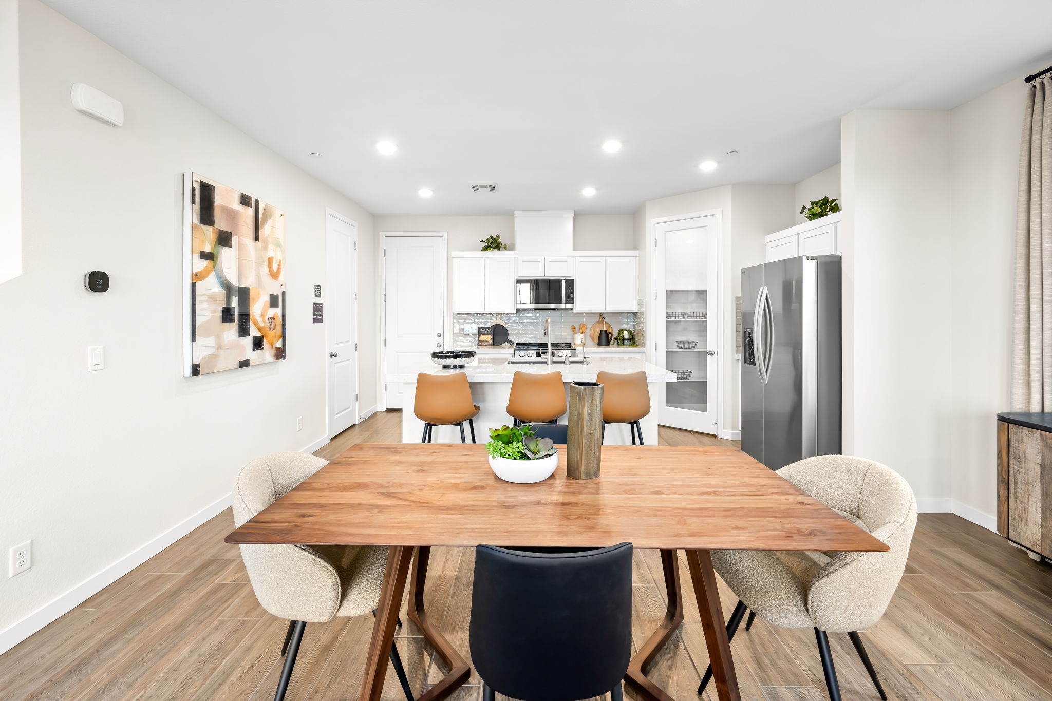 A kitchen with a dining table.