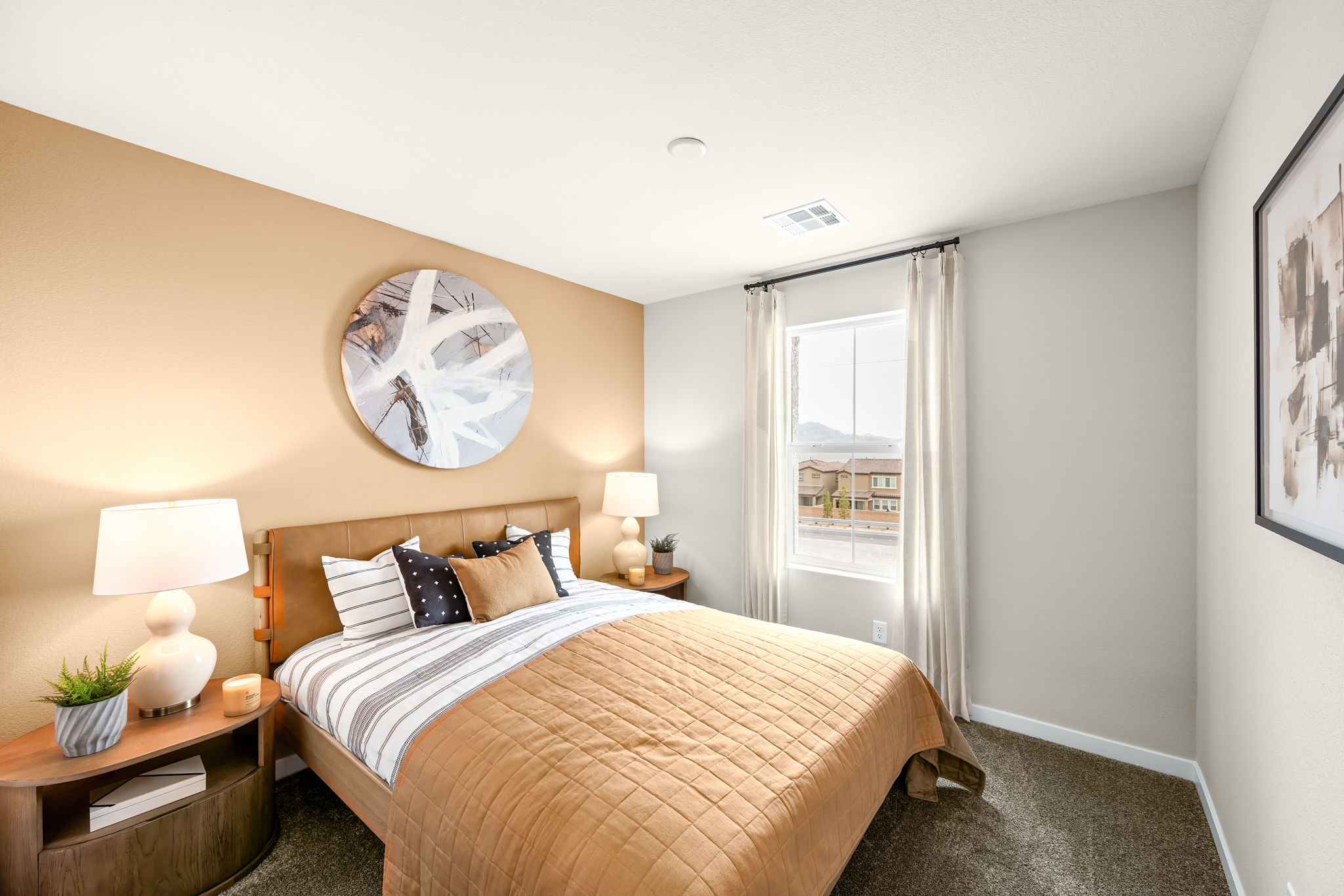 A bedroom with a large mirror.