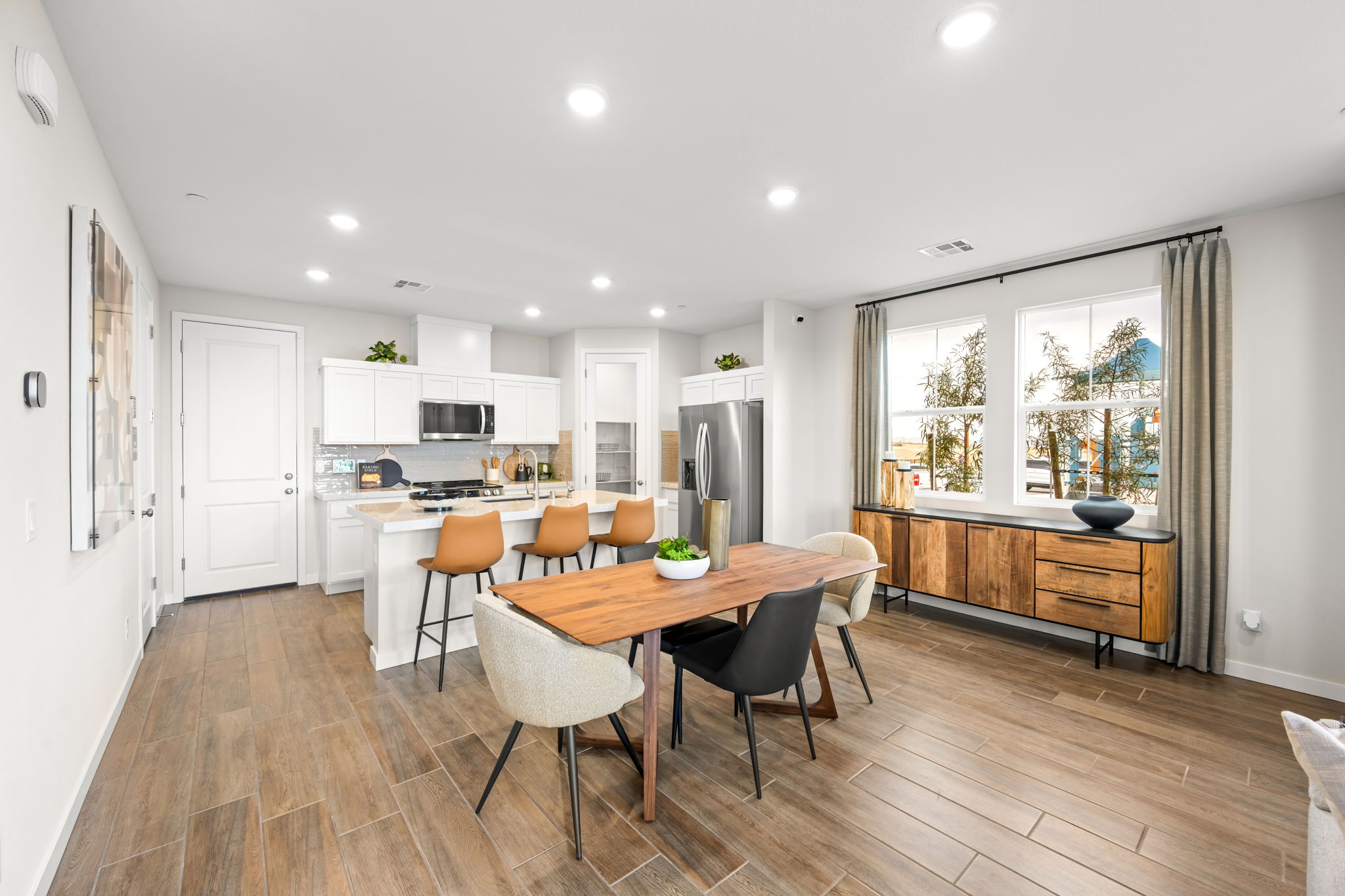 A kitchen with a wood floor.