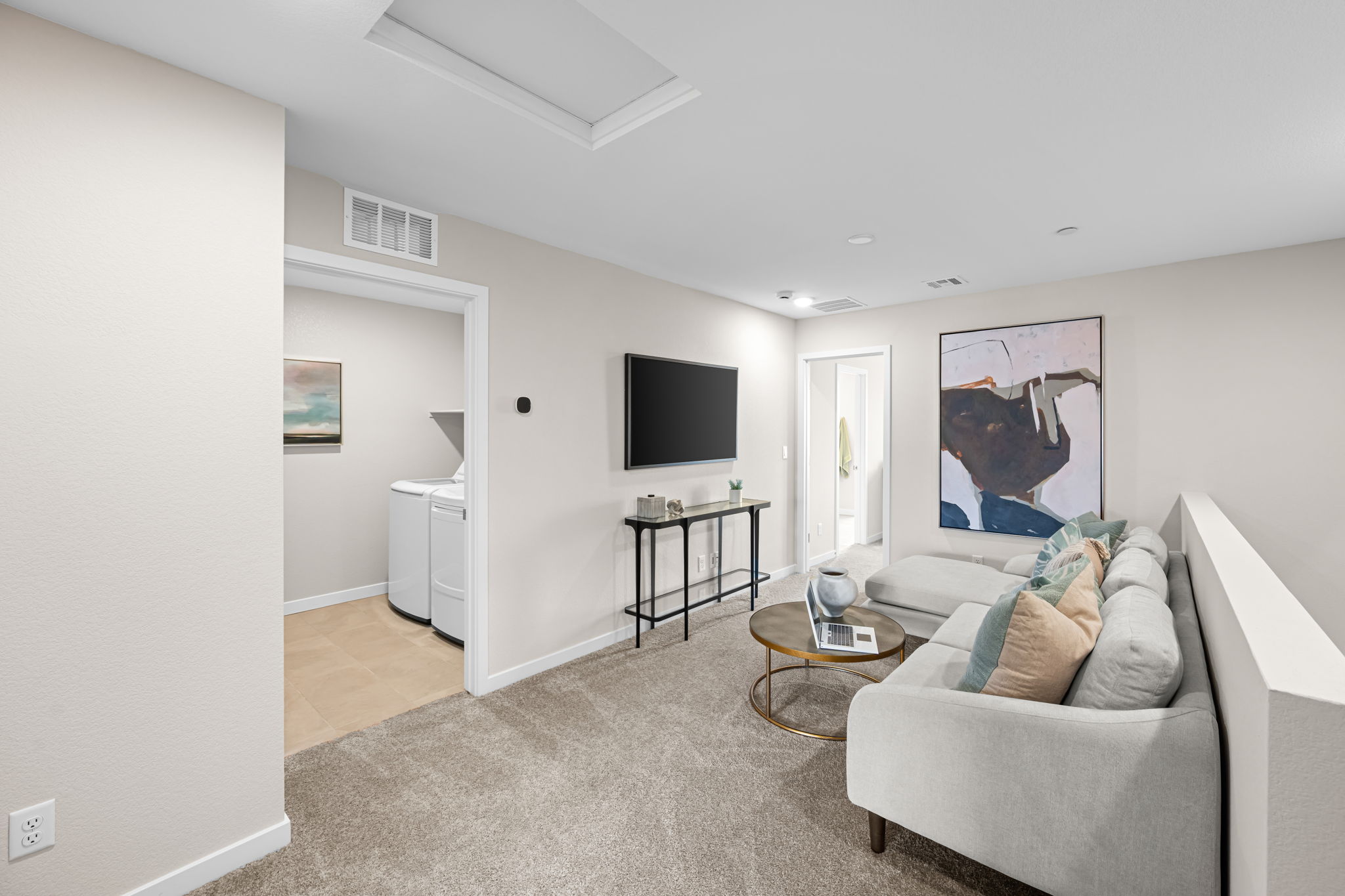 A living room with a tv and couches.