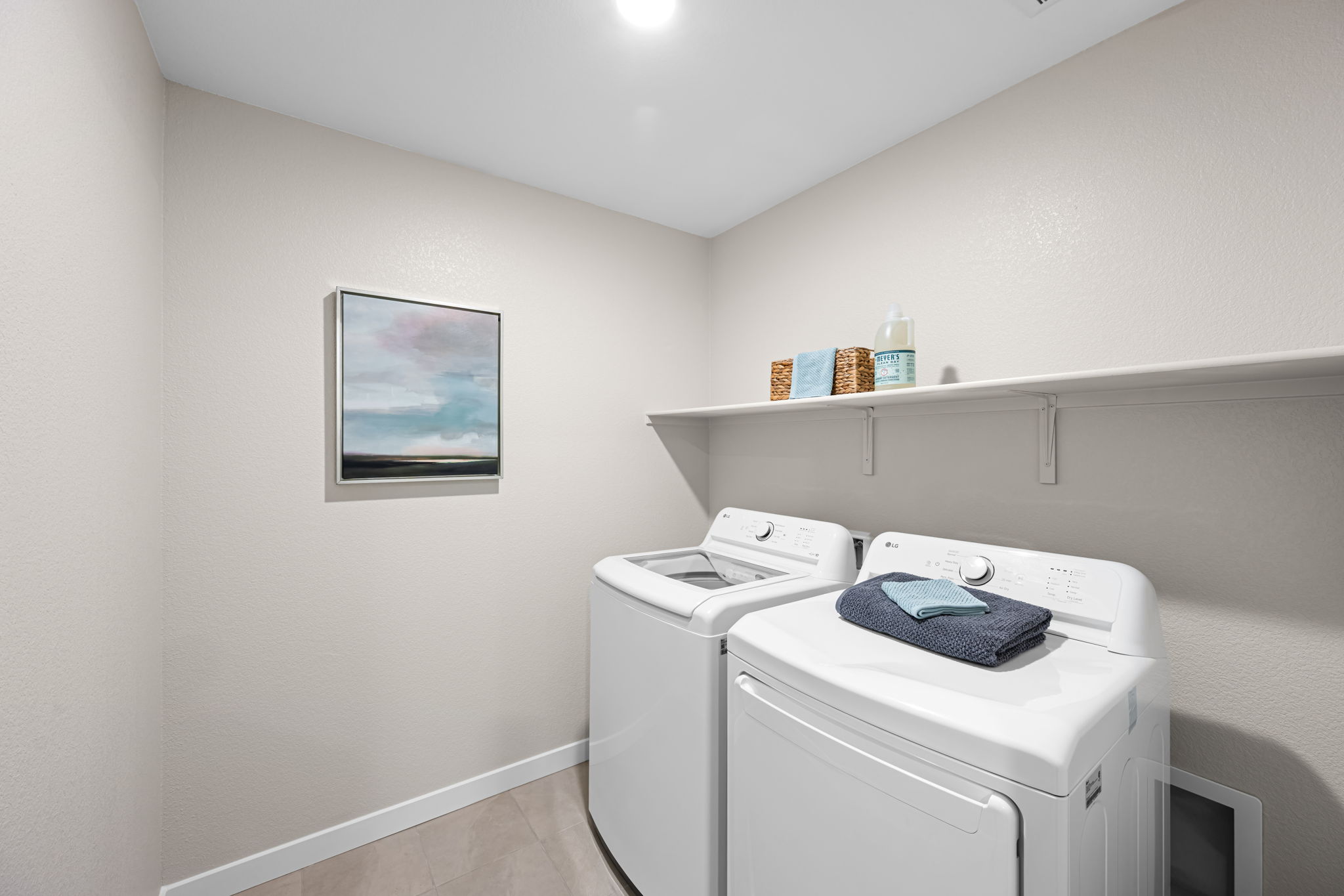 A laundry room with a washer and dryer.