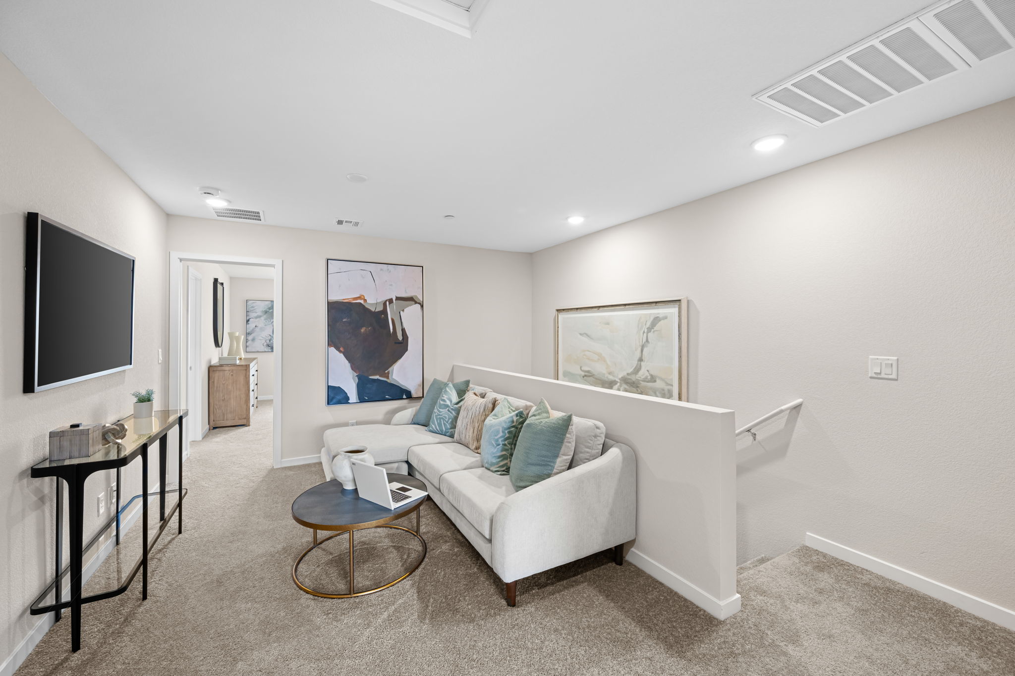 A living room with a white couch.