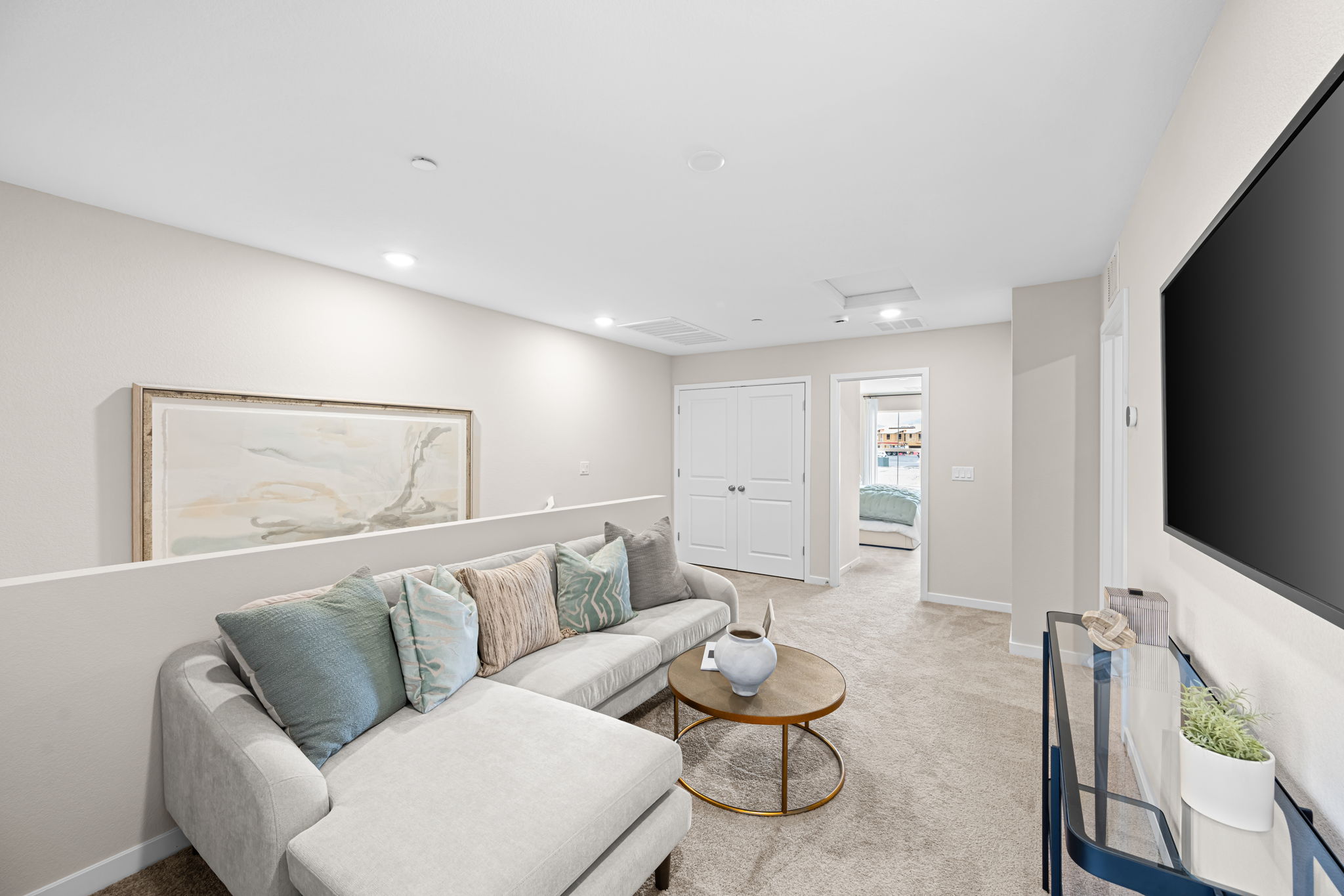 A living room with a couch and a tv.