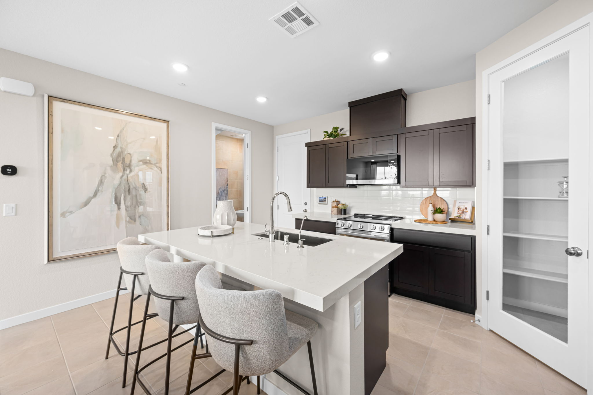 A kitchen with a white counter top.