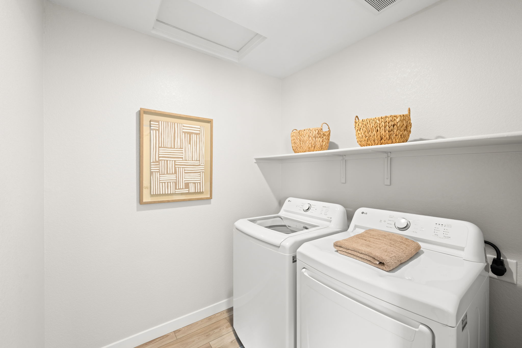 A laundry room with a basket and a basket on the wall.