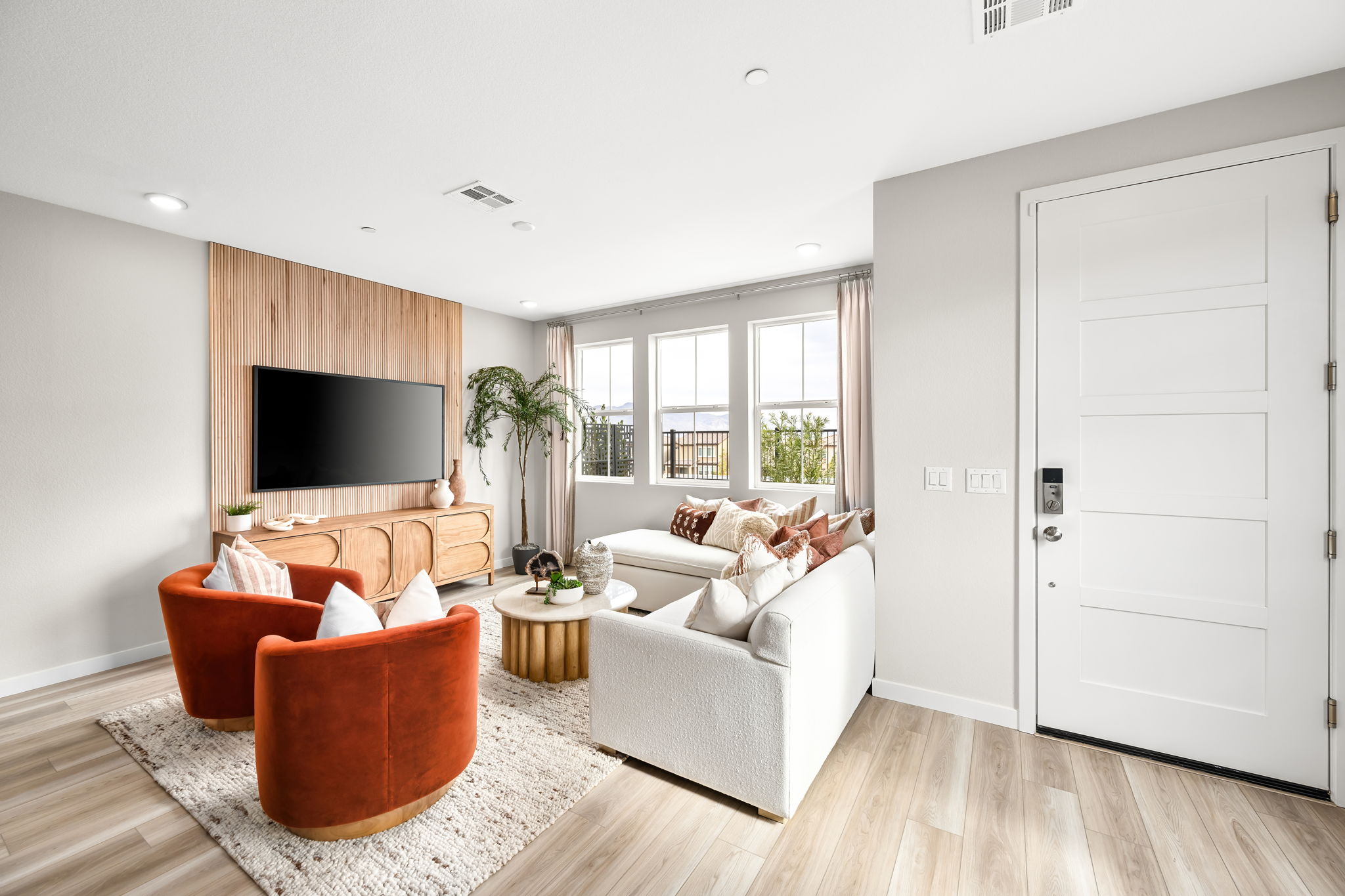 A living room with a tv and couches.