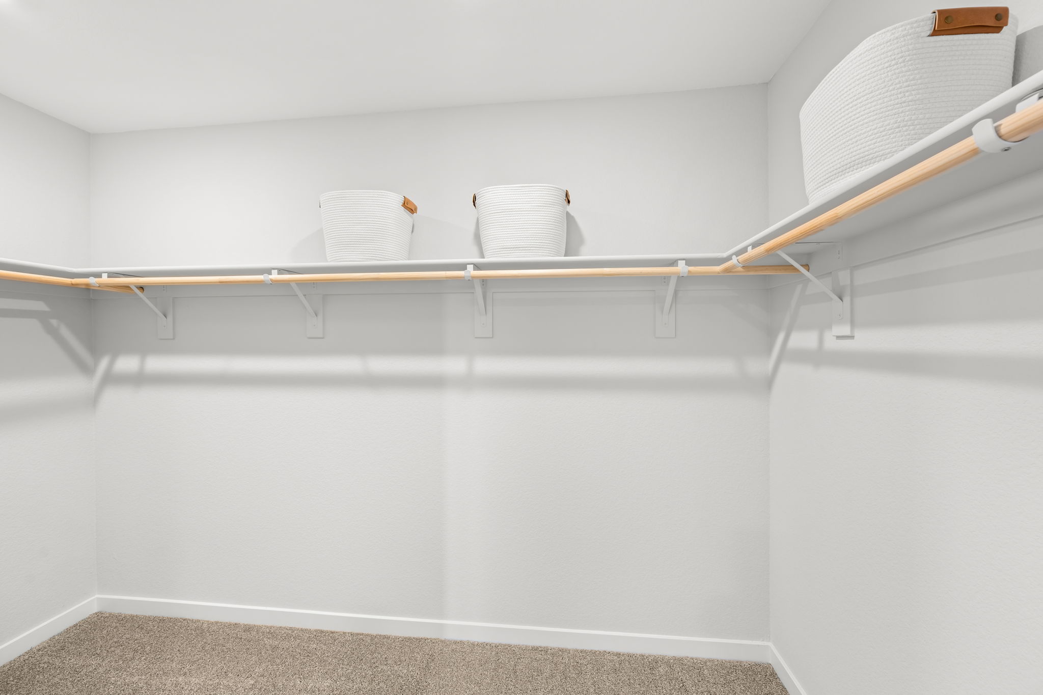 A shelf with white cups on it.