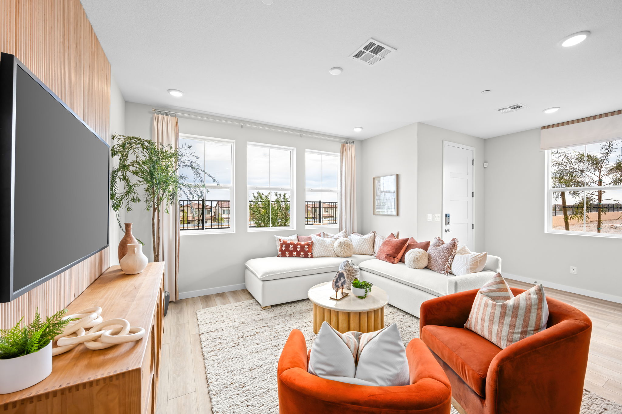 A living room with a tv and couches.