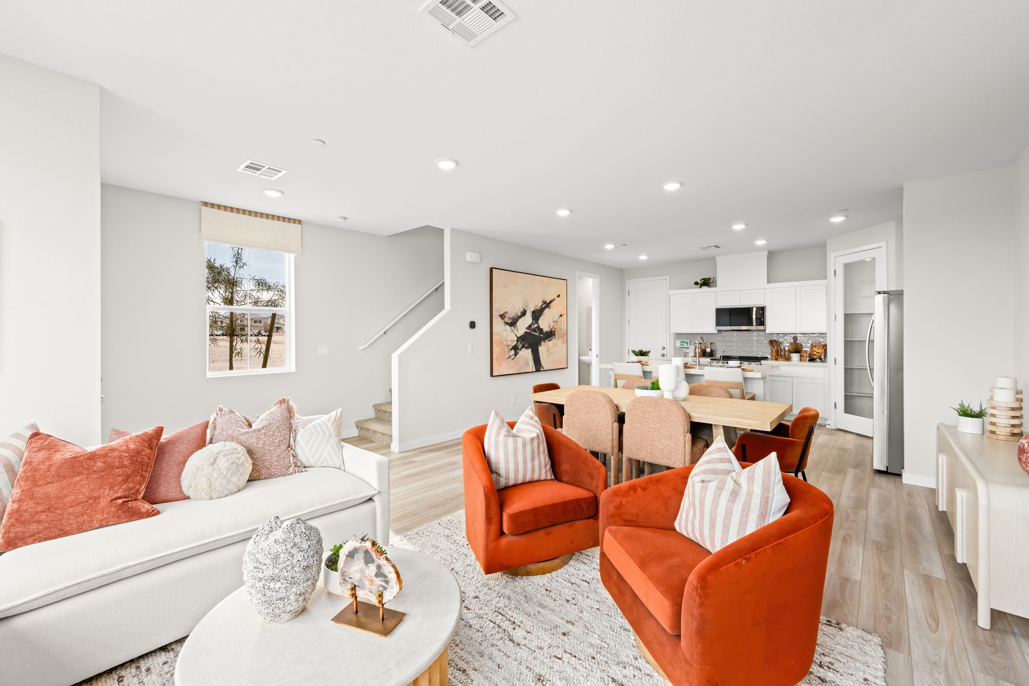 A living room with a couch and a table.