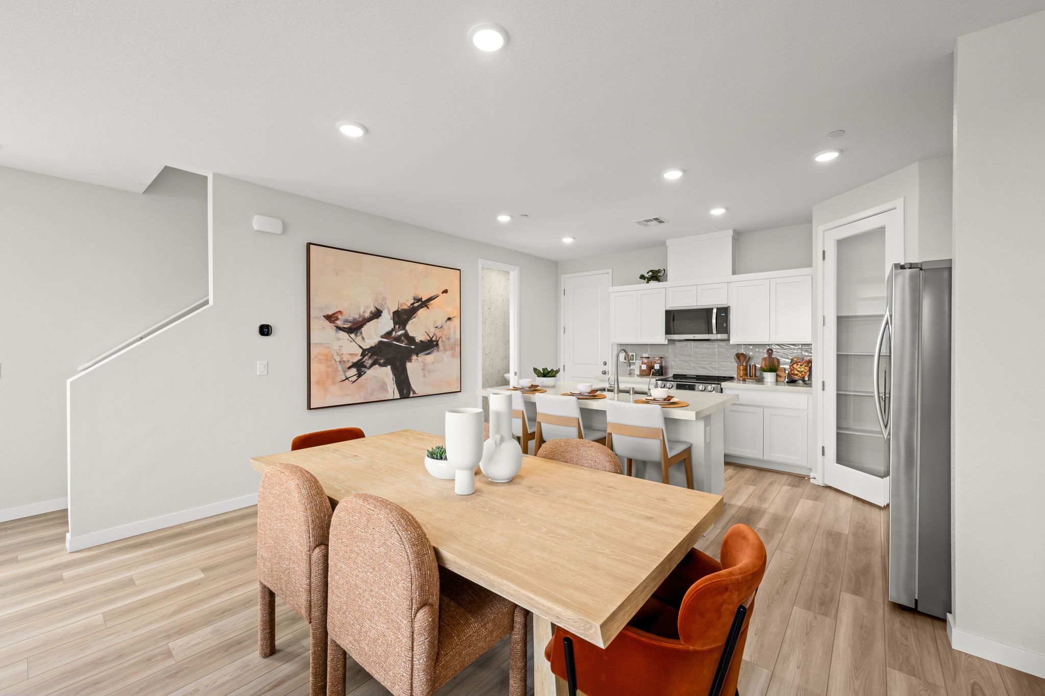 A kitchen with a dining table.