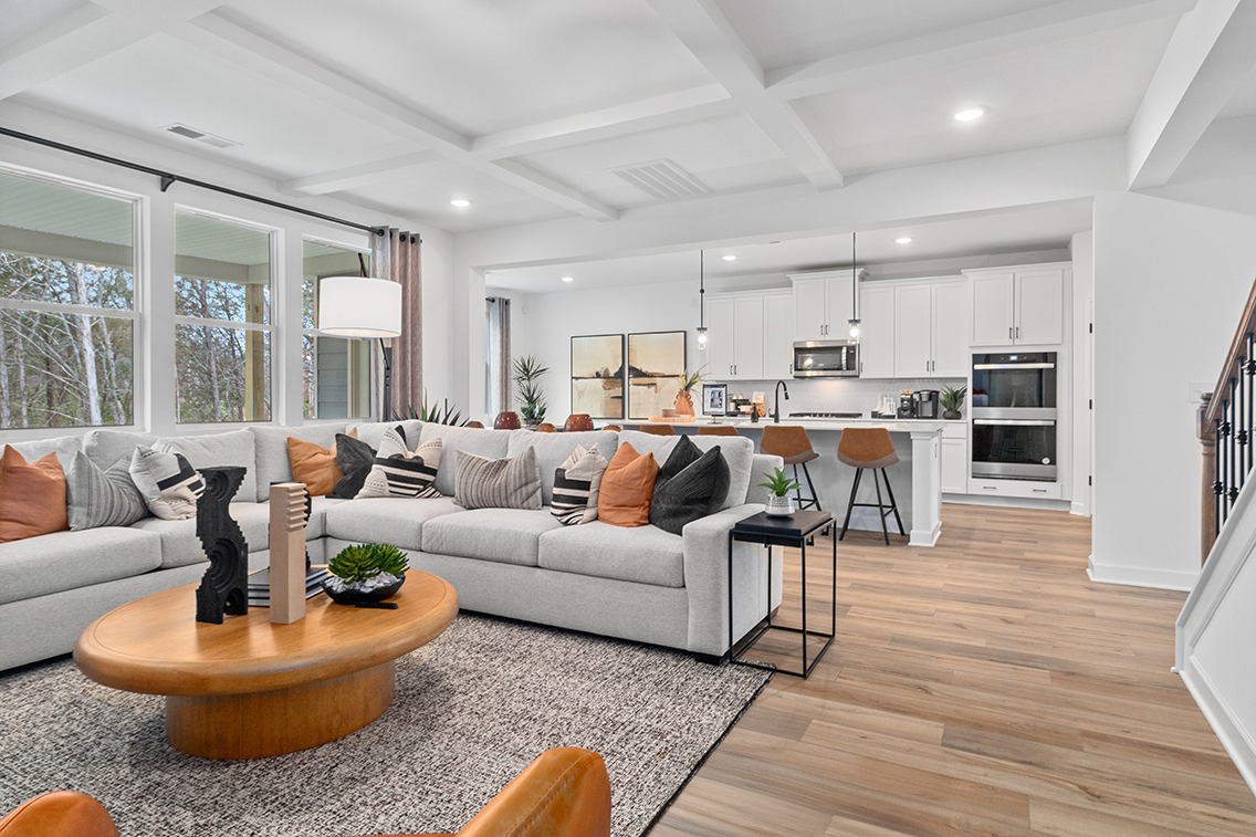 A living room with a couch and a table.