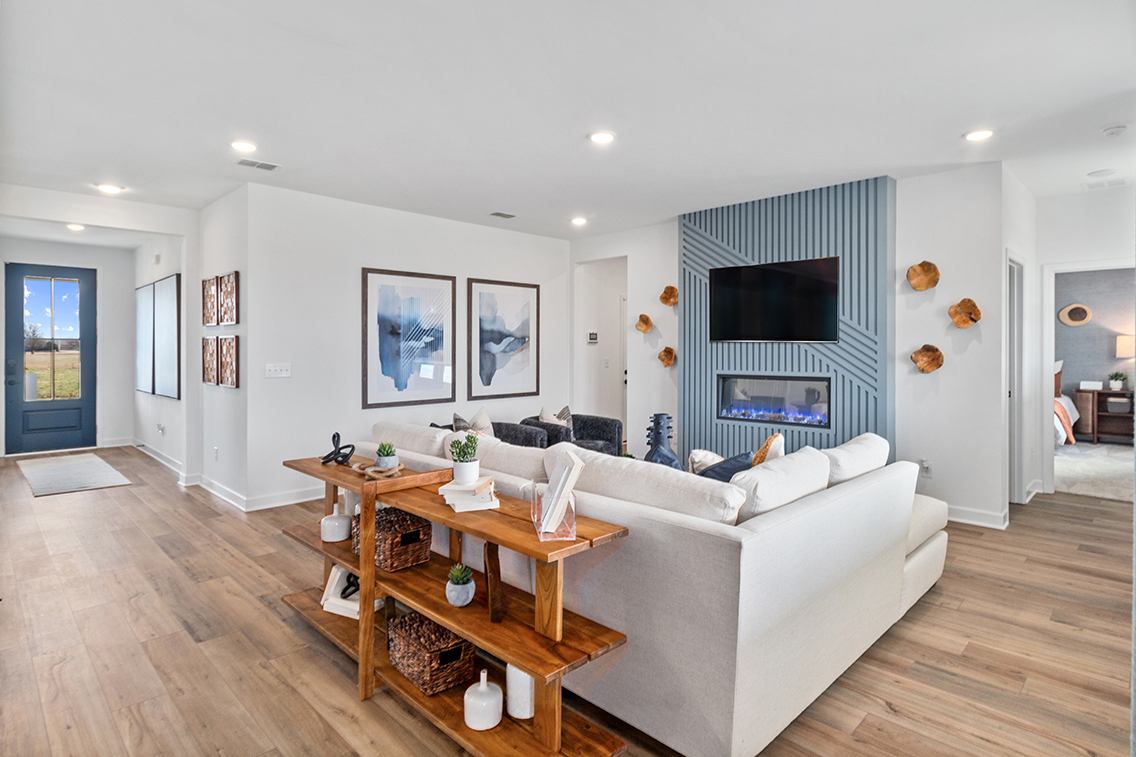 A living room with a large white couch.