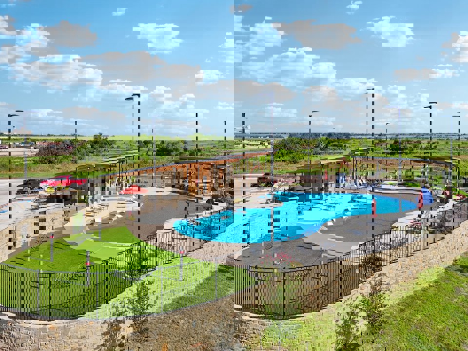 A swimming pool with a fence around it.