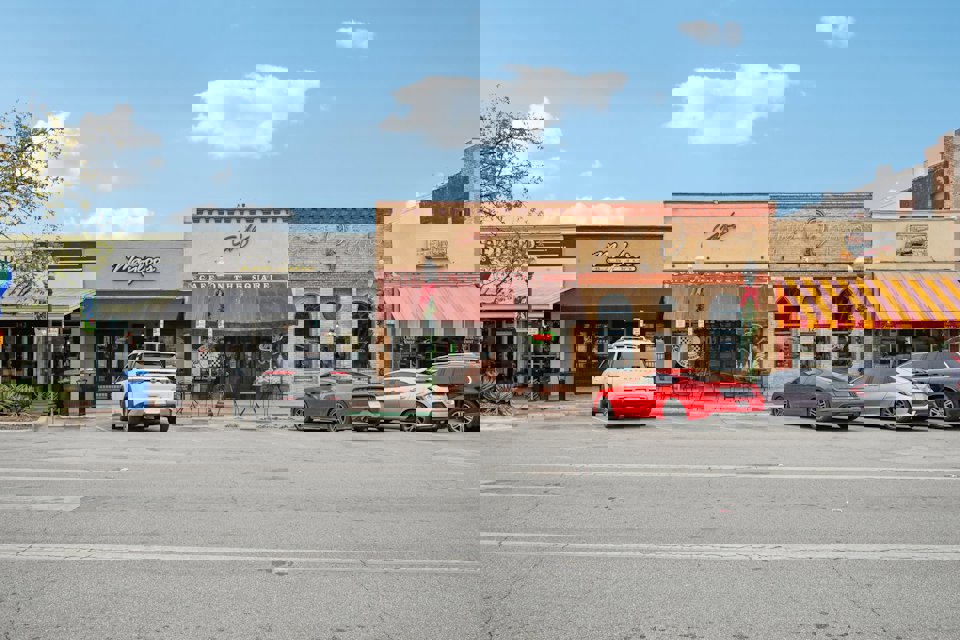 A parking lot in front of a store.