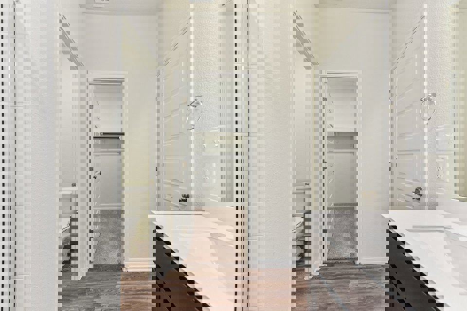 A bathroom with a toilet and sink.