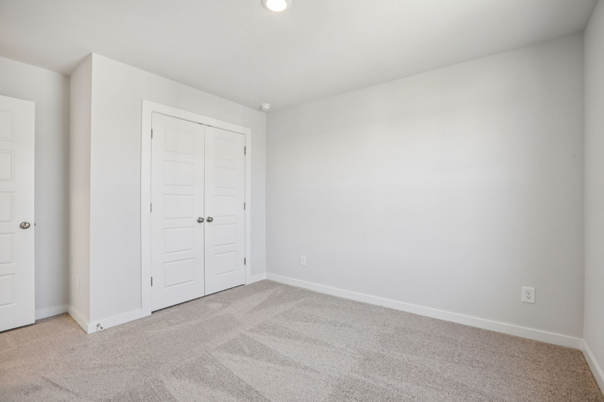 A room with white doors.