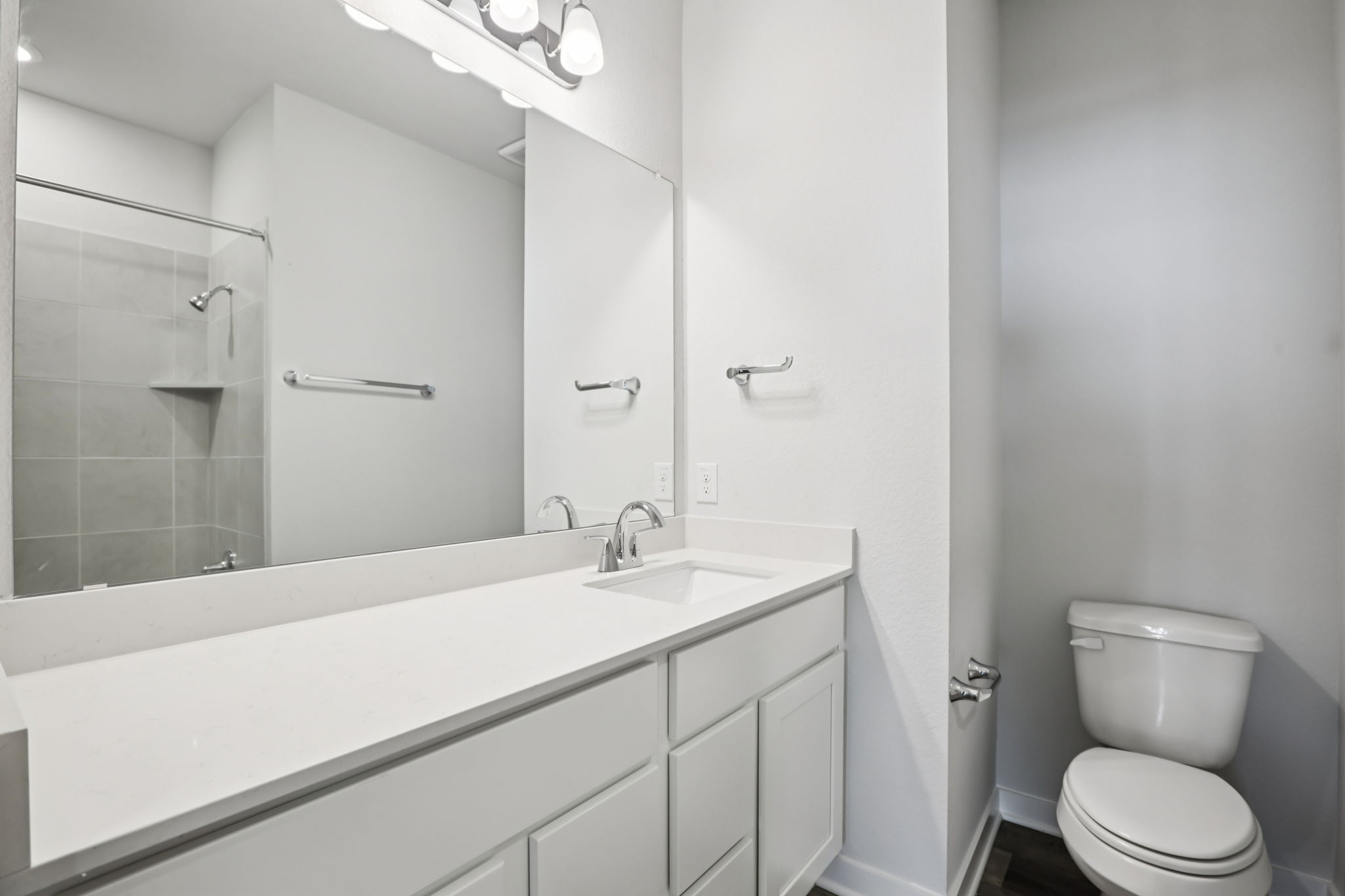 A bathroom with a glass shower.