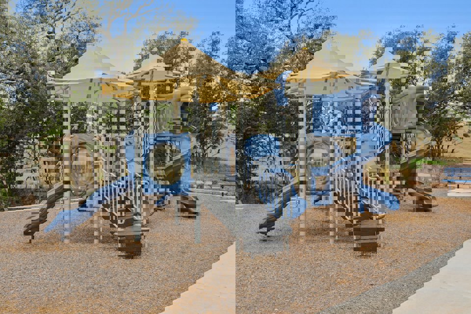 A playground with slide and slide.