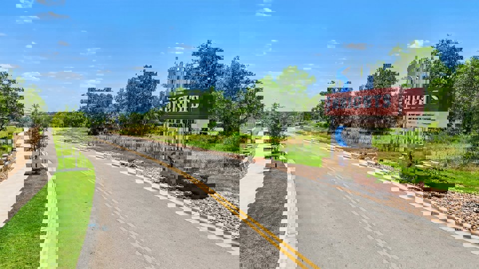 A road with a sign on it.