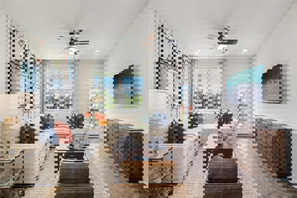 A living room with a wood floor.