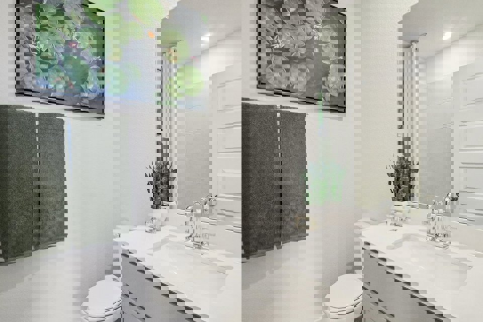 A bathroom with a sink and a toilet.