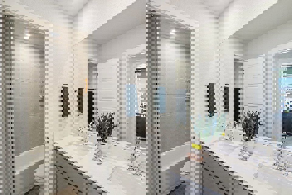 A bathroom with a sink and a toilet.