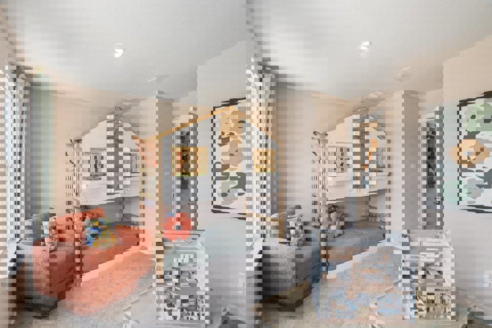 A living room with a bed and a couch.