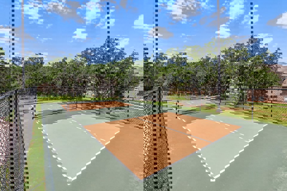 A tennis court with a net.