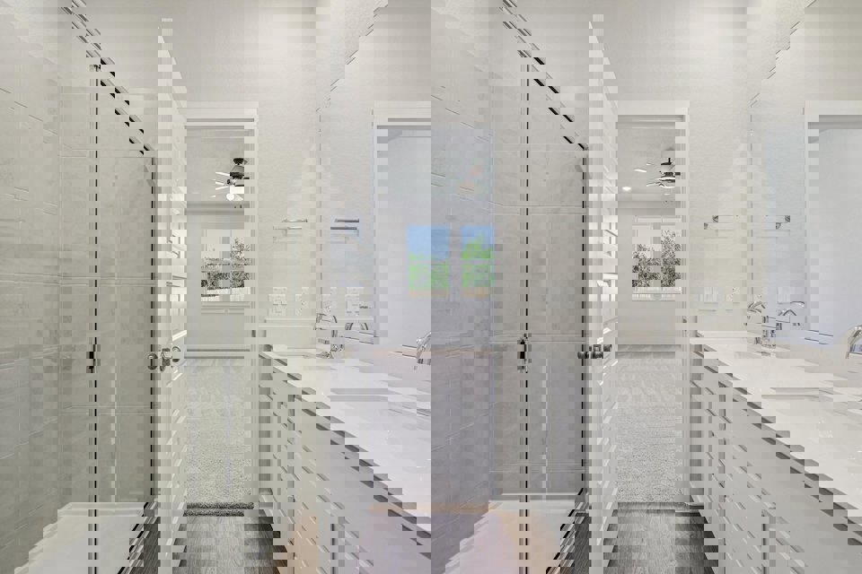 A bathroom with a glass shower.